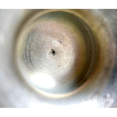 169 - A white metal eastern vase and two small silver top glass pots, the vase of baluster form decorated ... 