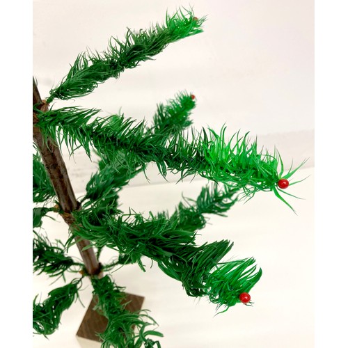 188 - A rare artificial table Christmas tree, circa 1920's, with dyed green goose feather 'leaves / needle... 