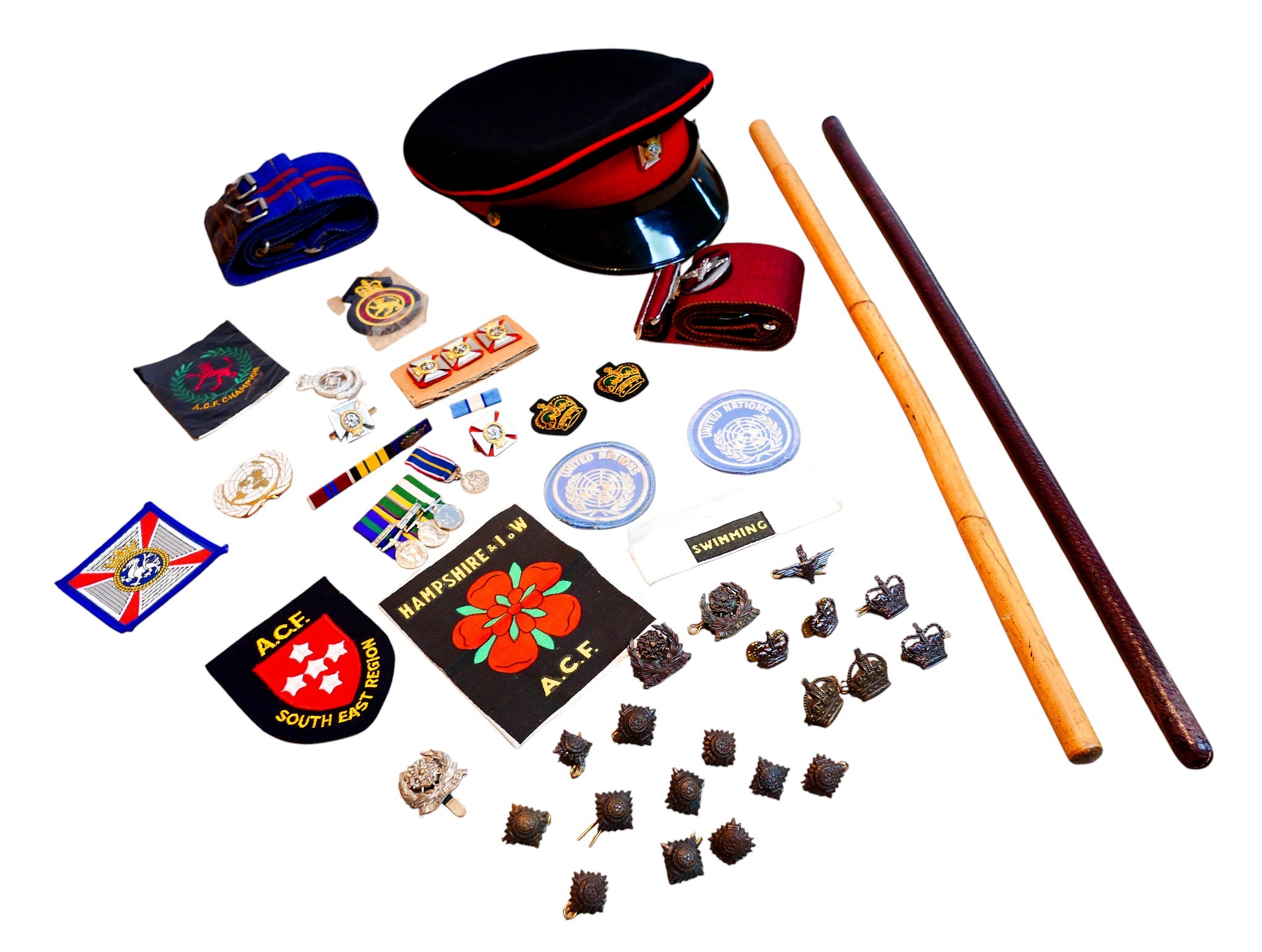 A collection of 20th and 21st century militaria, including swagger ...