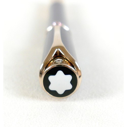 220 - A Montblanc Princess Grace of Monaco roller ball pen, in royal purple and gold trim with pink sapphi... 