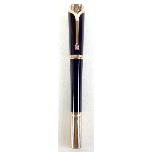 220 - A Montblanc Princess Grace of Monaco roller ball pen, in royal purple and gold trim with pink sapphi... 