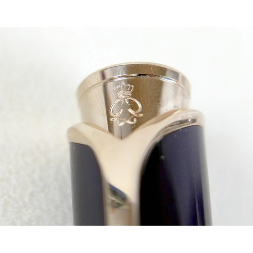 220 - A Montblanc Princess Grace of Monaco roller ball pen, in royal purple and gold trim with pink sapphi... 