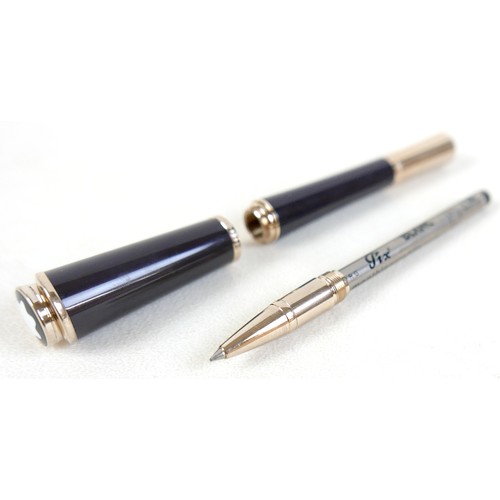 220 - A Montblanc Princess Grace of Monaco roller ball pen, in royal purple and gold trim with pink sapphi... 