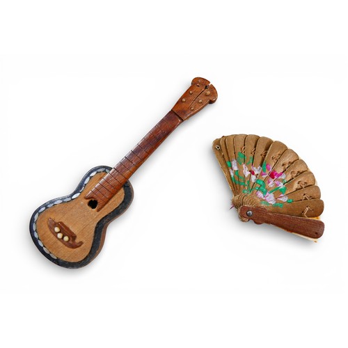 76 - A group of doll's house furnishings and accessories, including a two pieces of miniature Satsuma sty... 