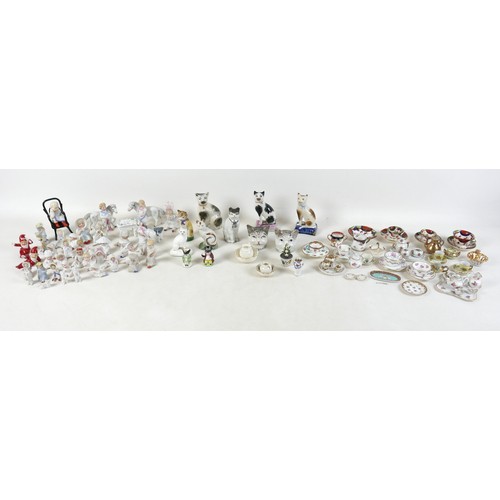 53 - A collection of miniature ceramics, including nine Staffordshire & Continental figures, modelled as ... 