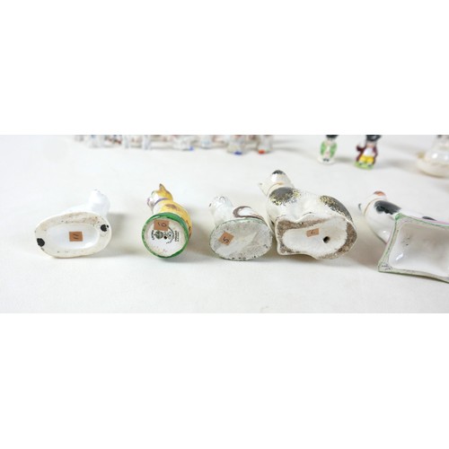 53 - A collection of miniature ceramics, including nine Staffordshire & Continental figures, modelled as ... 