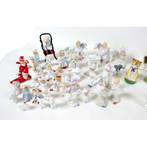 53 - A collection of miniature ceramics, including nine Staffordshire & Continental figures, modelled as ... 