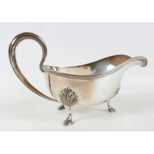 230 - A small collection of silver plate, including an Elkington plate sauce boat, some flatware. (1 box)