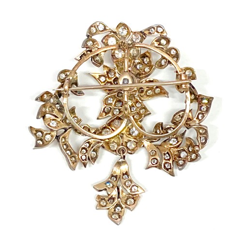 178 - A late 19th century gold and diamond set trembleuse brooch, possibly French, set with over 100 round... 