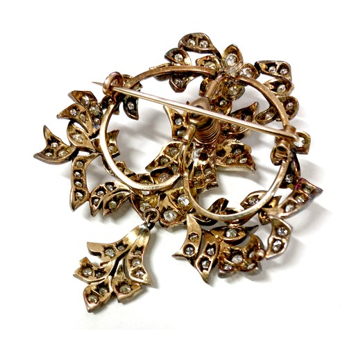 178 - A late 19th century gold and diamond set trembleuse brooch, possibly French, set with over 100 round... 