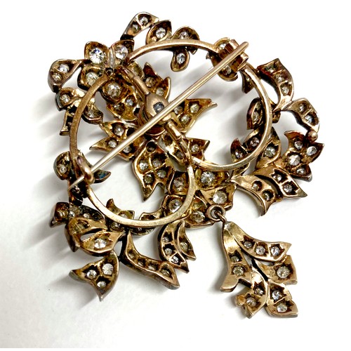 178 - A late 19th century gold and diamond set trembleuse brooch, possibly French, set with over 100 round... 