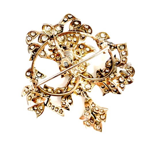 178 - A late 19th century gold and diamond set trembleuse brooch, possibly French, set with over 100 round... 
