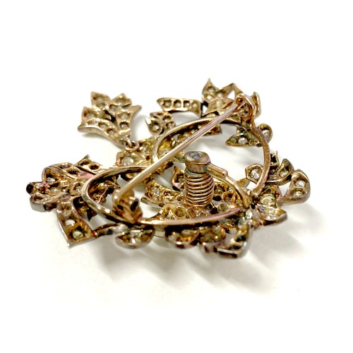 178 - A late 19th century gold and diamond set trembleuse brooch, possibly French, set with over 100 round... 