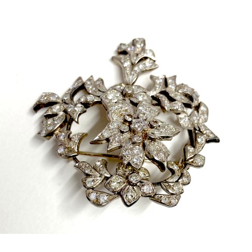 178 - A late 19th century gold and diamond set trembleuse brooch, possibly French, set with over 100 round... 