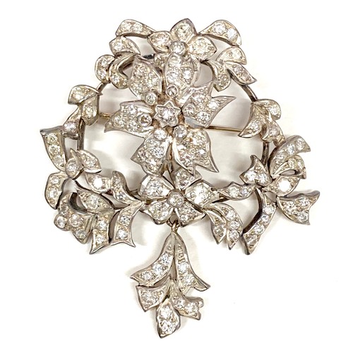 178 - A late 19th century gold and diamond set trembleuse brooch, possibly French, set with over 100 round... 