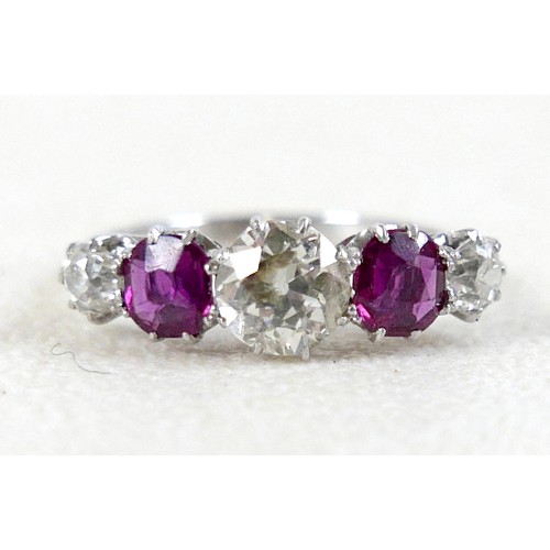 179 - A platinum five stone diamond and ruby ring, the central diamond approximately 0.75ct flanked by sma... 
