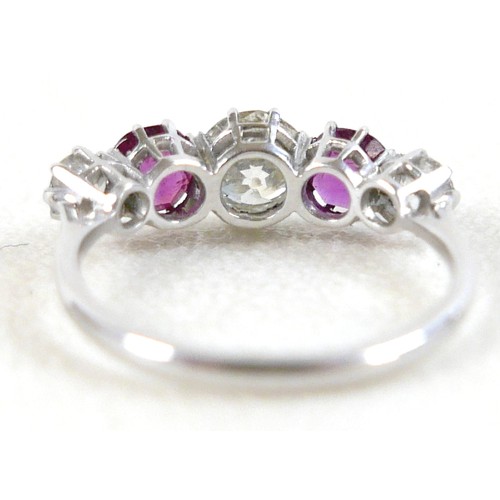 179 - A platinum five stone diamond and ruby ring, the central diamond approximately 0.75ct flanked by sma... 