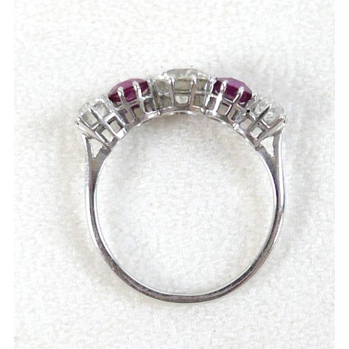 179 - A platinum five stone diamond and ruby ring, the central diamond approximately 0.75ct flanked by sma... 