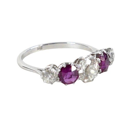 179 - A platinum five stone diamond and ruby ring, the central diamond approximately 0.75ct flanked by sma... 