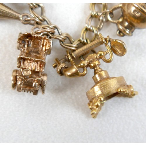 174 - A 9ct yellow gold charm bracelet with eight charms, 25.7g.