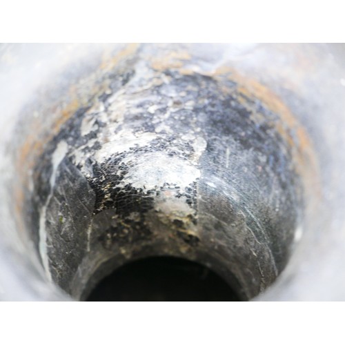 311 - A pair of Oriental bronze dragon urns, each decorated in high relief with a dragon chasing a flaming... 