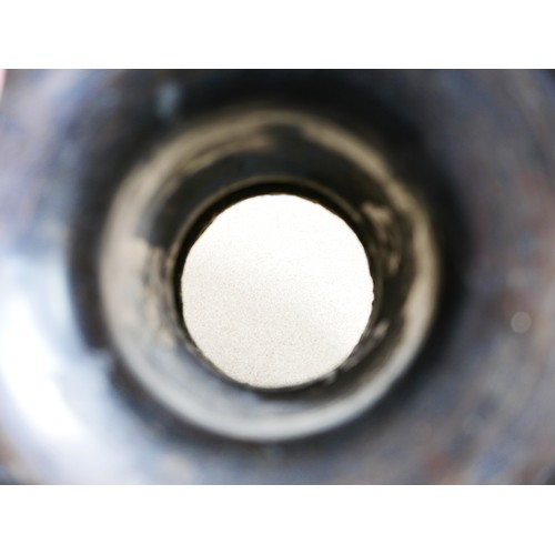 311 - A pair of Oriental bronze dragon urns, each decorated in high relief with a dragon chasing a flaming... 