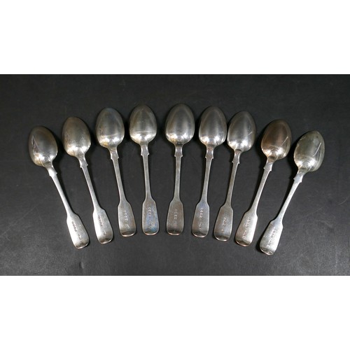 225 - A matched set of nine Victorian silver table spoons, Fiddle pattern, terminal engraved with an initi... 