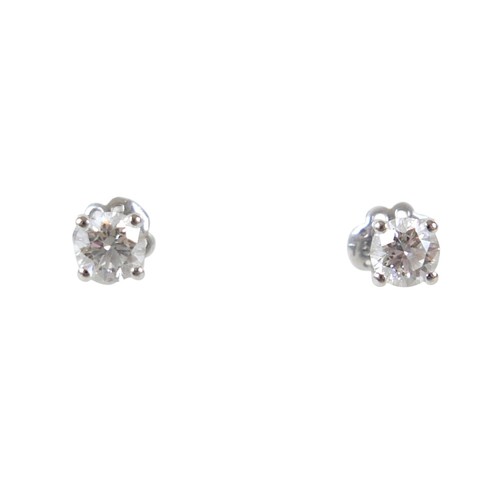 177 - A pair of diamond solitaire stud earrings, set in 18ct white gold, each stone approx. 0.7ct, SI2, co... 