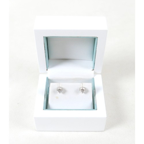 177 - A pair of diamond solitaire stud earrings, set in 18ct white gold, each stone approx. 0.7ct, SI2, co... 