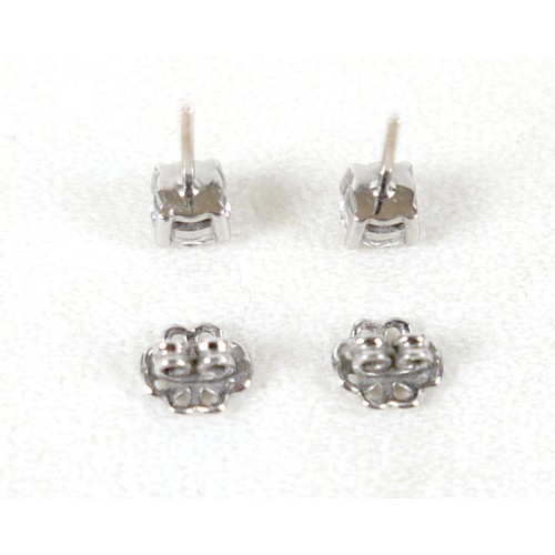 177 - A pair of diamond solitaire stud earrings, set in 18ct white gold, each stone approx. 0.7ct, SI2, co... 