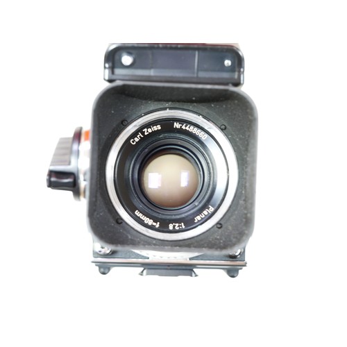 283 - A Hasselblad 503 CW camera and accessories, including a PME 51 Prism viewfinder, and a 80mm lens, in... 