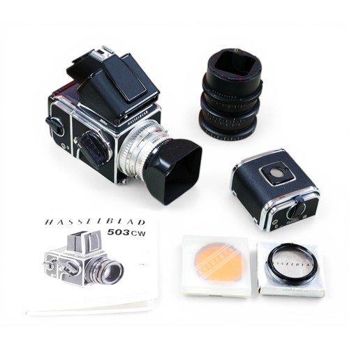 283 - A Hasselblad 503 CW camera and accessories, including a PME 51 Prism viewfinder, and a 80mm lens, in... 