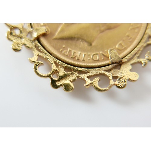 193 - A George V gold sovereign, 1912, in a 9ct gold coin pendant mount, 12.3g.