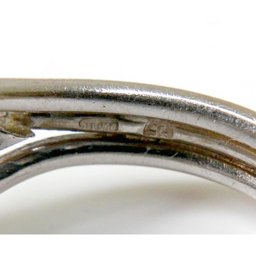 174 - A diamond set fancy cluster ring, centering on a marquise cut diamond, measuring 7.1mm by 4.2mm, dep... 