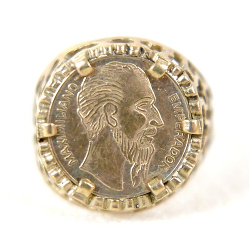 24 - A 9ct gold ring inset with yellow metal Mexican style coin, size Q, 3g.