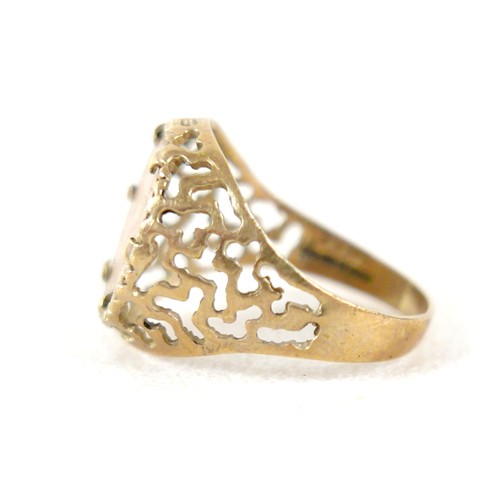 24 - A 9ct gold ring inset with yellow metal Mexican style coin, size Q, 3g.