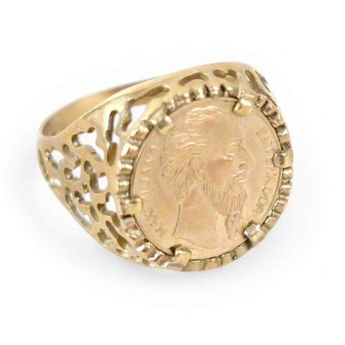 24 - A 9ct gold ring inset with yellow metal Mexican style coin, size Q, 3g.
