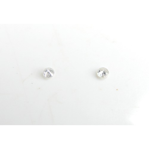 30 - Five loose rubies, including three oval cut stones, largest 9mm by 10mm, together with one round cut... 