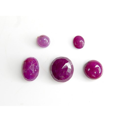 30 - Five loose rubies, including three oval cut stones, largest 9mm by 10mm, together with one round cut... 