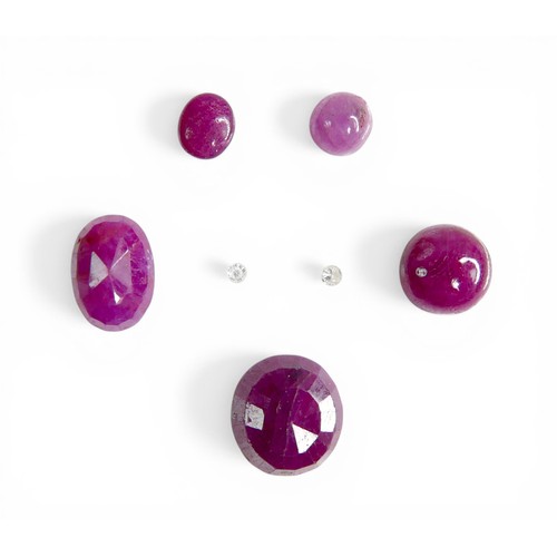 30 - Five loose rubies, including three oval cut stones, largest 9mm by 10mm, together with one round cut... 
