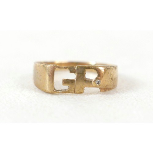 31 - A 9ct gold ring with initials 'GP', inlaid with a single diamond, approximately 1mm diameter, size X... 
