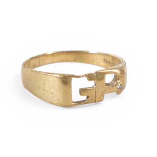 31 - A 9ct gold ring with initials 'GP', inlaid with a single diamond, approximately 1mm diameter, size X... 