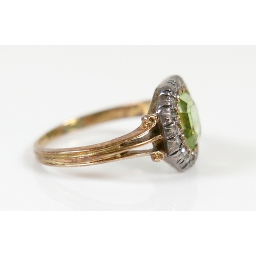 32 - An 18ct yellow gold peridot and diamond ring head size 10 by 10mm, ring size H, 2.2g.