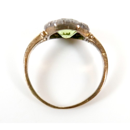 32 - An 18ct yellow gold peridot and diamond ring head size 10 by 10mm, ring size H, 2.2g.