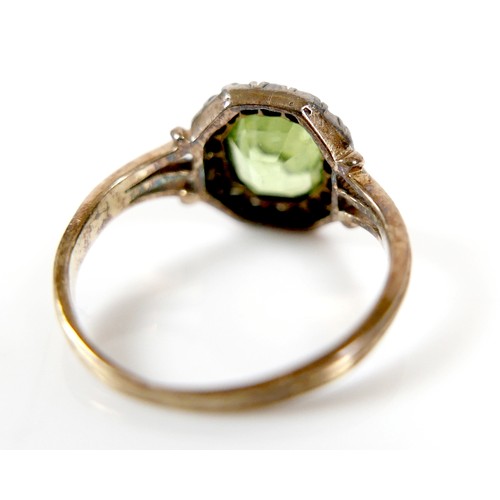 32 - An 18ct yellow gold peridot and diamond ring head size 10 by 10mm, ring size H, 2.2g.