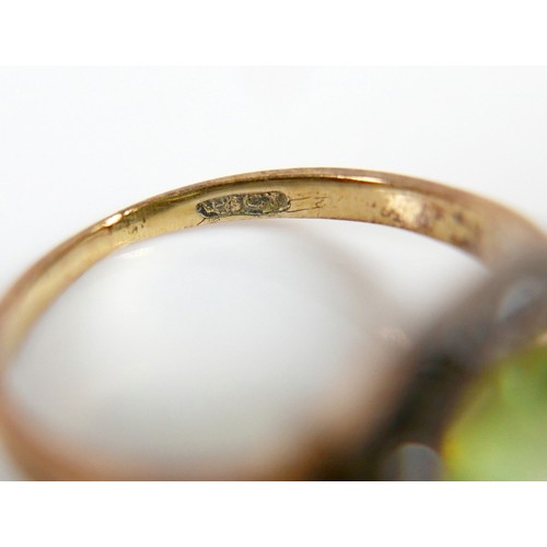 32 - An 18ct yellow gold peridot and diamond ring head size 10 by 10mm, ring size H, 2.2g.