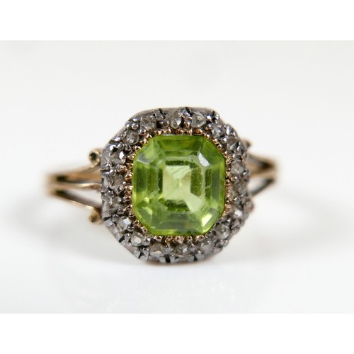 32 - An 18ct yellow gold peridot and diamond ring head size 10 by 10mm, ring size H, 2.2g.