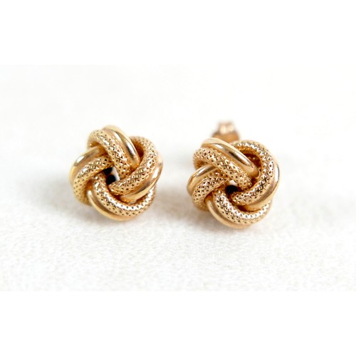 35 - A 14k gold and opal ring, designed as five rings attached at the base, total weight 5.62g (lacking t... 