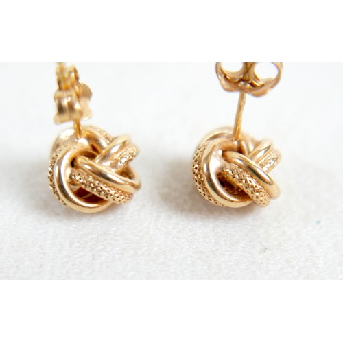 35 - A 14k gold and opal ring, designed as five rings attached at the base, total weight 5.62g (lacking t... 