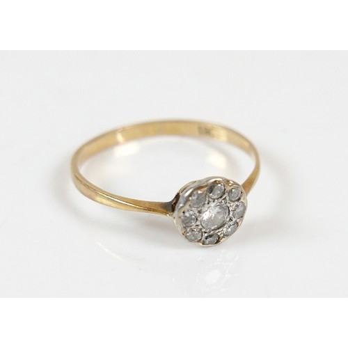 41 - An Edwardian 18ct yellow gold ring, set with nine diamonds in the form of a flowerhead, central ston... 